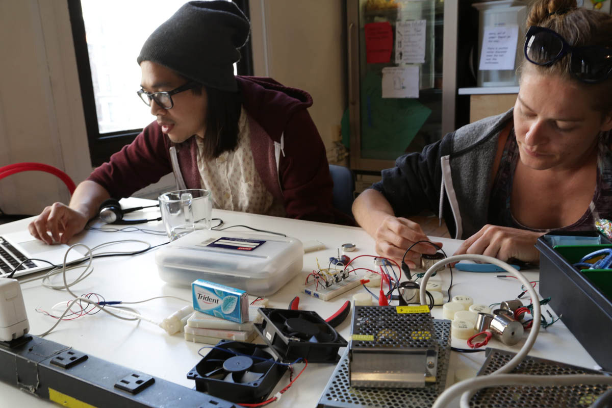 2 people working with physical computing 